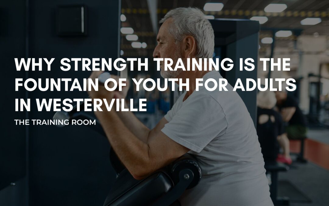 Trainer guiding adult client through strength training in Westerville Ohio gym